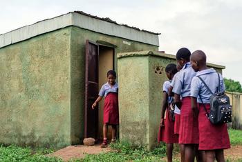 Children use toilet facilities at a school in Nigeria.