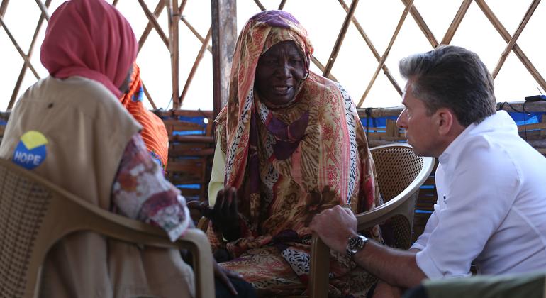 The UN's Emergency Relief Coordinator, Tom Fletcher, meets women at a site hosting displaced people in Tawila, Darfur.