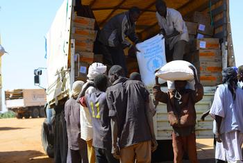 Food aid is delivered to displaced people in Zamzam camp in North Darfur.