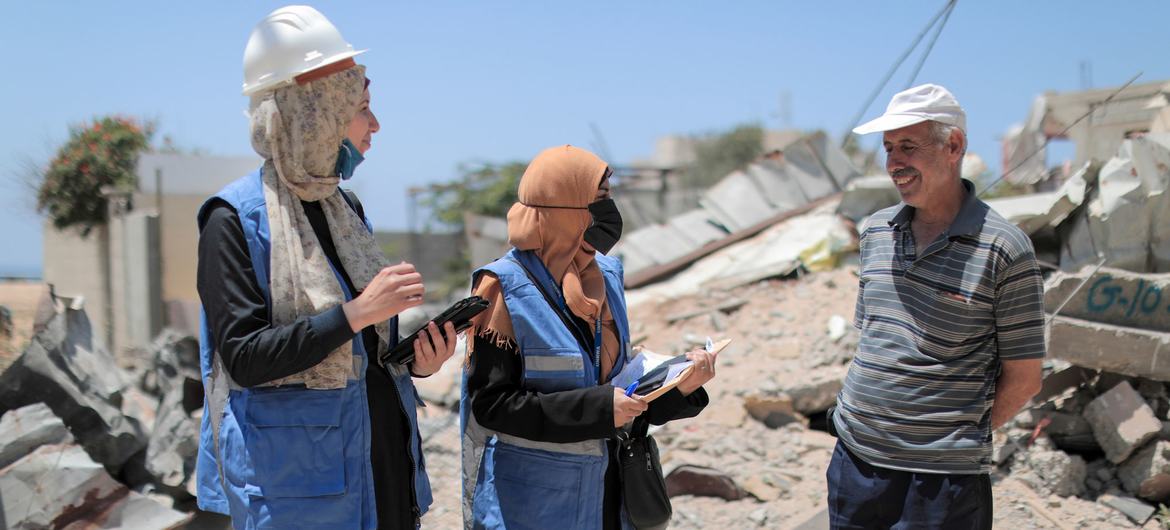 UNRWA engineers assess shelter damage in the occupied Palestinian territory after a military conflict in 2021.