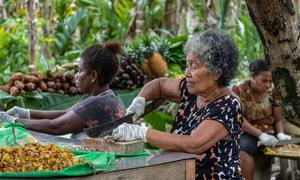 Women prepare vegetables during an event to learn healthy NCD prevention methods such as nutrition, in Tulagi, Solomon Islands.