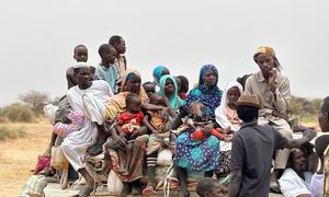 A caravan full of displaced families fleeing North Darfur's El Fasher in search of safety. Across Sudan, more than 12 million people have been driven from their homes.