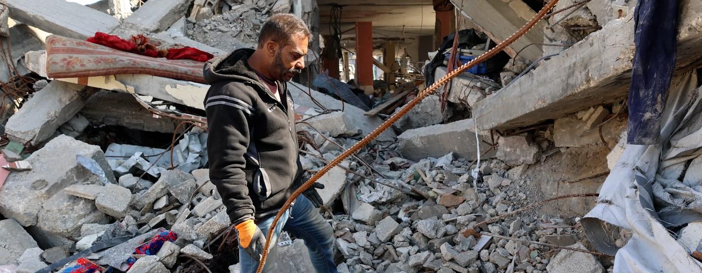 Sufyan Al-Majdalawi inspects the rubble of his home in Jabalia in northern Gaza. 