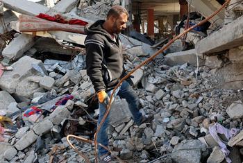 Sufyan Al-Majdalawi inspects the rubble of his home in Jabalia in northern Gaza. 