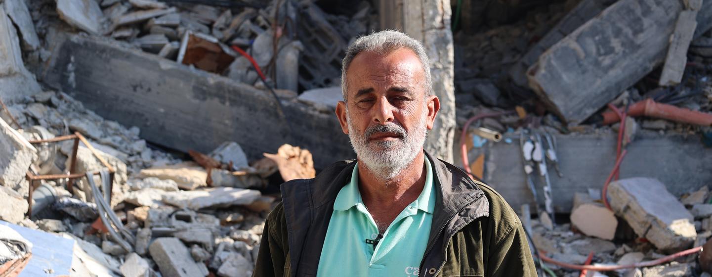 Yasser Ahmed stands in front of his destroyed home in Jabalia, in the north of the Gaza Strip.