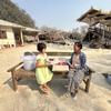 A woman and her granddaughter with relief supplies in a village in Mandalay, one of the regions hardest hit by the disaster.