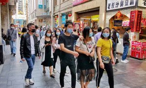 People mask up in Shenzhen, China. 