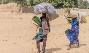 Aid is distributed to displaced families who fled violence in Nigeria and have settled in Niger.