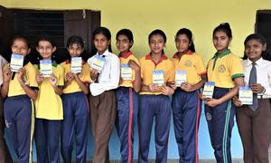 A group of students wait in line to get vaccinated against Measles-Rubella during the Outbreak Response Immunization campaign in Mahottari district of Madhesh Province.