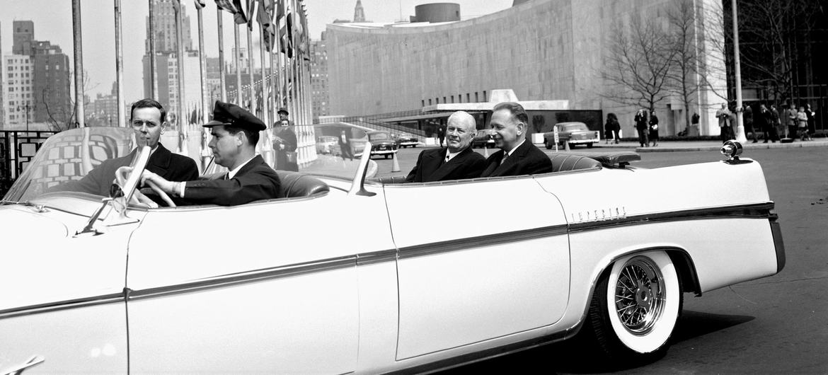 On the first day of his second term, Secretary-General Hammarskjöld (back of car, at right) leaves UN Headquarters on the way to the luncheon at the Waldorf-Astoria Hotel in his honour, hosted by New York City Mayor Robert Wagner.