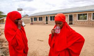 On 26 October 2022, at Daley village in Garissa County, Kenya - (L to R) Nasteha (13) and Siham (13) of Daley primary school drink safe and clean water coming from the UNICEF-supported solar-powered borehole in the village.