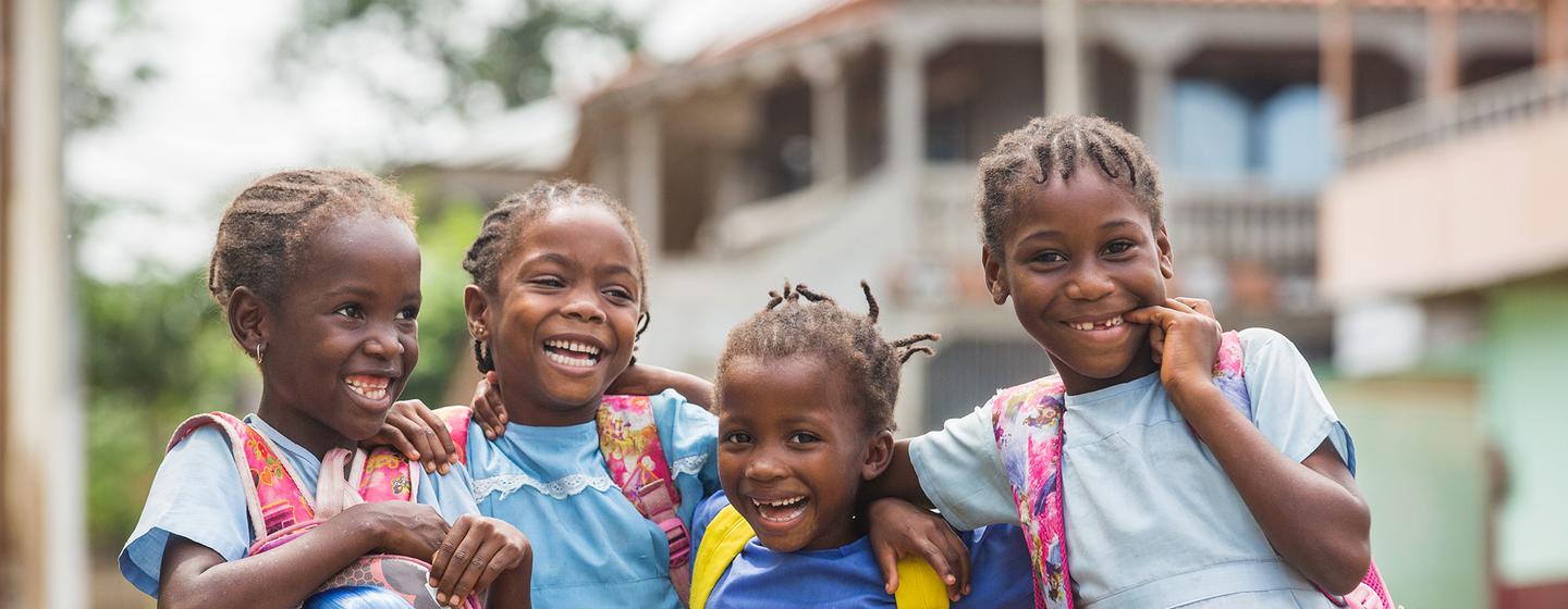 Young girls walk home from school in São Tomé and Príncipe.