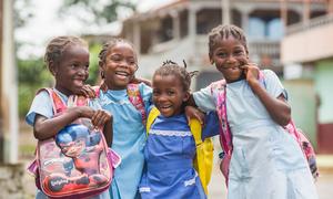 Young girls walk home from school in São Tomé and Príncipe.