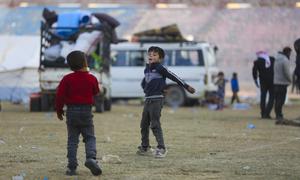 Two boys play at a reception centre in Raqqa city in northern Syria. Their families recently returned to the country.