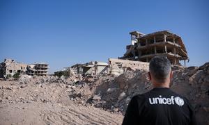 Qays Sheikh Najib, UNICEF Syria Ambassador, stands with his back to the camera observing the rubble of destroyed buildings in Jobar, Rural Damascus, Syria, on 18 November 2025.