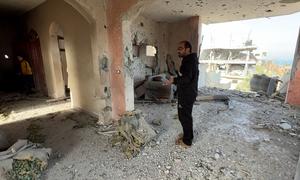 Shadi Jomaa Abu Sheha inside what's left of his home in north of Nuseirat, Gaza.