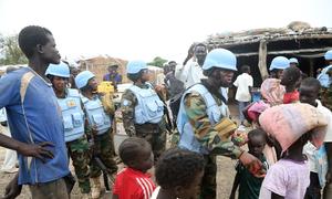 Ghanaian Engagement Platoon Commander with peacekeeping force UNISFA, Captain Cecilia Erzuah, has been named the UN's Military Gender Advocate of the Year for 2022. She's pictured here handing out sweets to children.