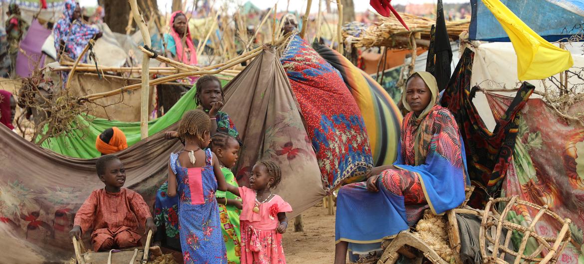 People seek shelter at a refugee entry point located 5 km from the Chadian border with Sudan. Most of these people were already internally displaced in the Darfur region.