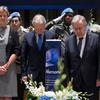 The UN Secretary-General António Guterres (right) honours the memory of UN personnel who lost their lives in the line of service in 2022.