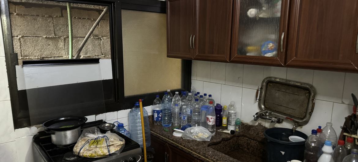 Ahmad's kitchen has nothing but empty water bottles and a bag of bread.