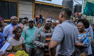Dr Thierno Baldé (back to camera) at a health facility where WHO supported the deployment of an emergency medical team in Goma.
