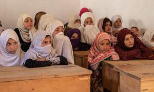 A group of elementary school girls sit in their classroom at a high school in Nuristan Province, Afghanistan.