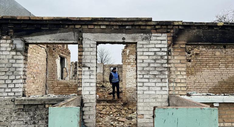 A UNDP expert inspects a war-damaged building. Before starting the work of clearing debris, each site is carefully inspected for the presence of dangerous objects, such as unexploded ordnance.