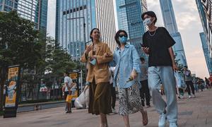 People wear face masks in Shenzhen, Guangdong Province, China.