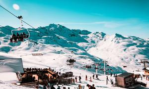 Skiers ride the lifts in a resort in the French Alps.