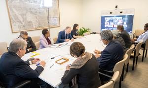 Secretary-General António Guterres (left at table) participates in a virtual meeting on the situation in Sudan.