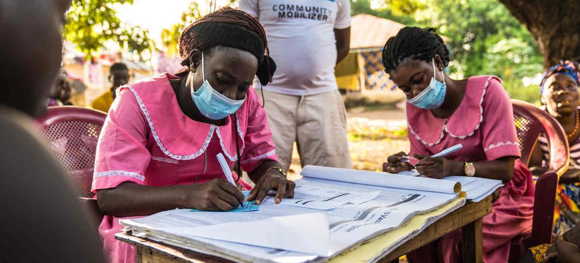 Nurses work at a mobile COVID-19 vaccination clinic in Rofunta, Sierra Leone, in December 2022.