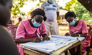 Nurses work at a mobile COVID-19 vaccination clinic in Rofunta, Sierra Leone, in December 2022.