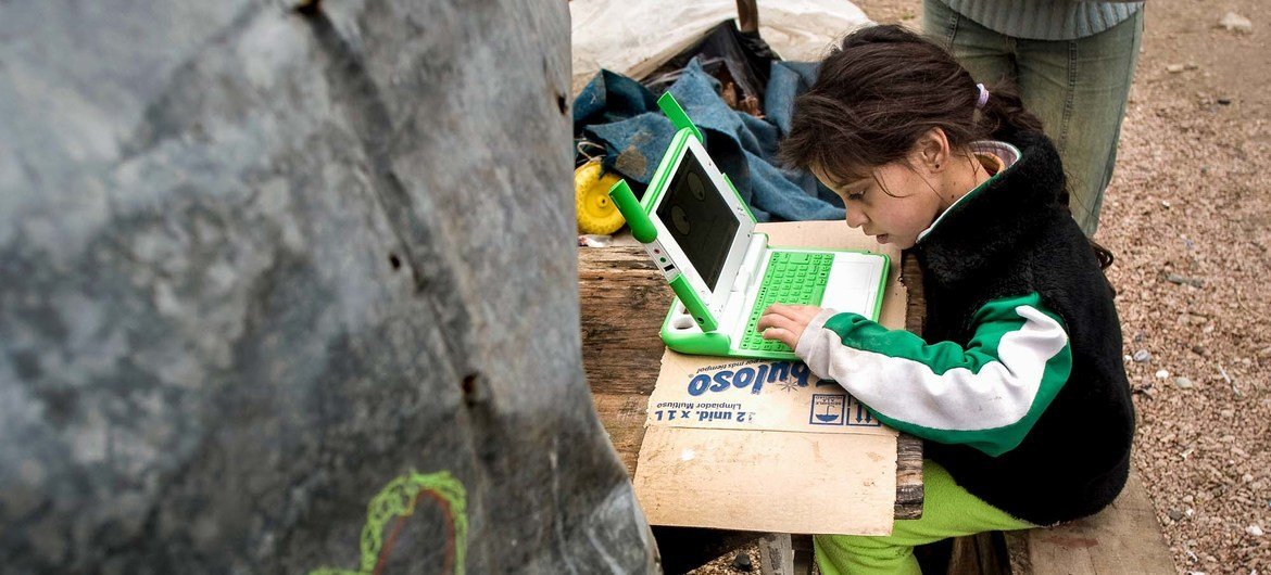 A young girl uses a computer to study, highlighting the power of digital learning to open up new opportunities for children everywhere. A young girl uses a computer to study, highlighting the power of digital learning to open up new opportunities for children everywhere.