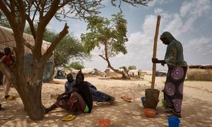 Refugee women prepare food in a displacement site in Ouallam, in the Tillaberi region of Niger.