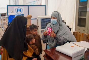 At a UNHCR centre near the Torkham border, an Afghan family recently returned from Pakistan receives a health consultation.