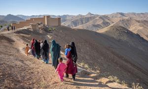 A group of women and their children walk Daikundi in remote central Afghanistan.