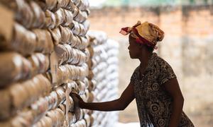 A woman works in a WFP food warehouse in Kananga, DR Congo.