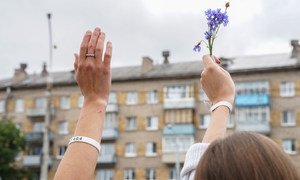 A flower is held in peaceful protest against the disputed presidential election in Belarus.