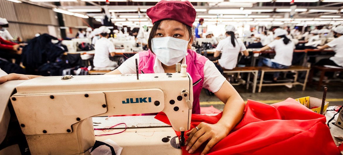 A woman works at a Better Work-affiliated factory in Viet Nam. A woman works at a Better Work-affiliated factory in Viet Nam.