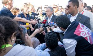 UN Secretary-General António Guterres (centre) answers questions from the media at the Rafah crossing.