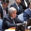 Secretary-General António Guterres (left at table) addresses the Security Council meeting on maintenance of international peace and security, sustaining peace through common development.