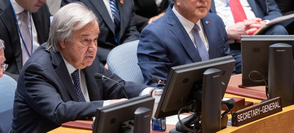 Secretary-General António Guterres (left at table) addresses the Security Council meeting on maintenance of international peace and security, sustaining peace through common development.