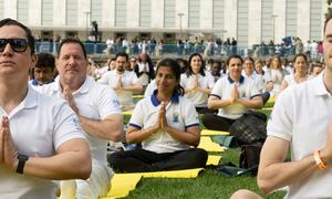 Participants join an event at UN Headquarters in New York to mark the 9th International Day of Yoga.