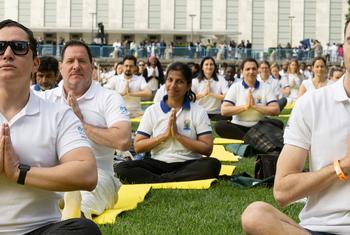Participants join an event at UN Headquarters in New York to mark the 9th International Day of Yoga.