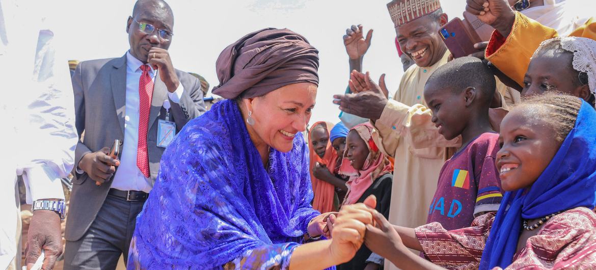 United Nations Deputy Secretary-General Amina Mohammed meets young children at a refugee camp in Chad.