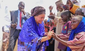 United Nations Deputy Secretary-General Amina Mohammed meets young children at a refugee camp in Chad.