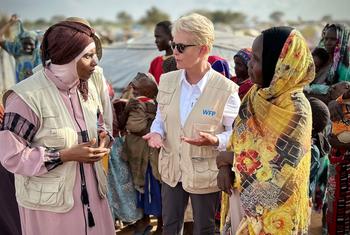 WFP Executive Director Cindy McCain (centre),  talks to staff at refugee camp in Chad.