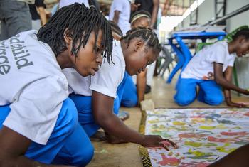 A group of girls in Mozambique make a mural with their hand prints as part of a UNICEF campaign against child marriage. Despite setbacks, some SDGs have recorded progress, such as target 5.3 on ending child marriage.
