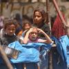Children in Gaza wait in the hope of receiving food.