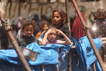 Children in Gaza wait in the hope of receiving food.